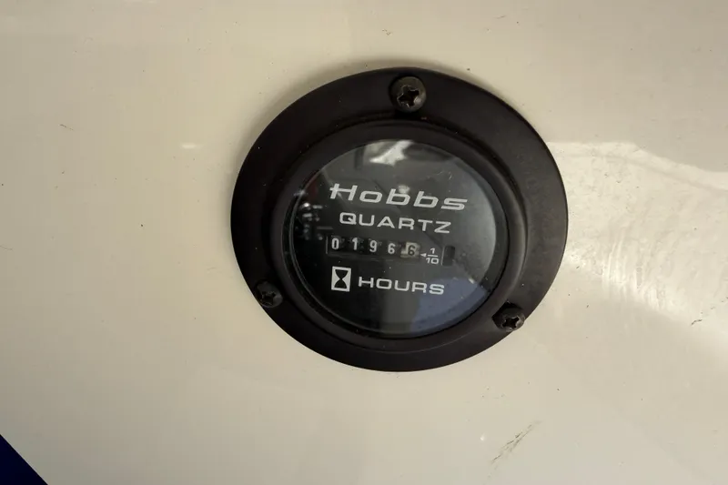 Slide: The Image of Hobbs Quartz hour meter on 2004 Cobalt 250, displaying 1966.1 hours. - 29