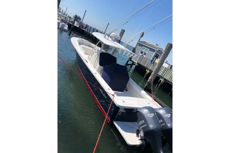 Slide: The Image of 2015 Regulator 34SS boat docked with twin Yamaha 350 engines. - 7