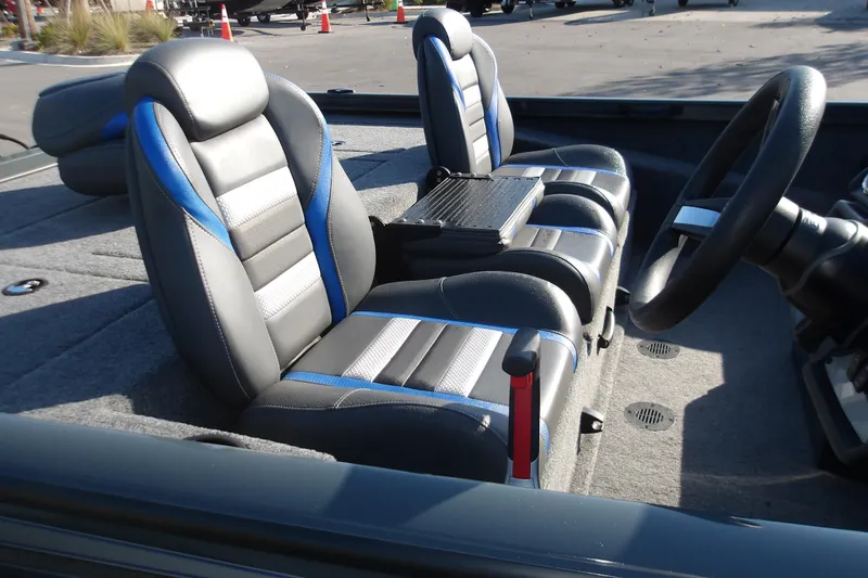 Slide: The Image of 2024 Ranger RT188P boat interior with sleek, modern seating and steering wheel. - 6