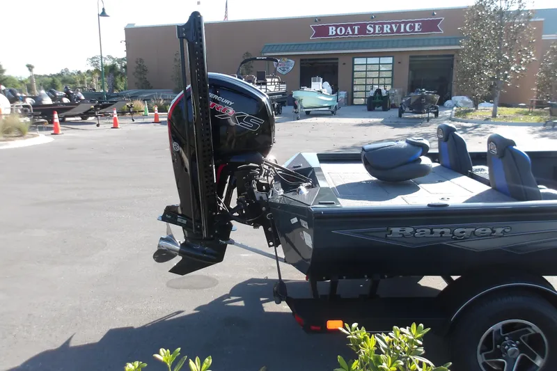 Slide: The Image of 2024 Ranger RT188P boat with Mercury engine at a boat service center. - 8