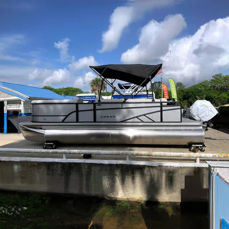 The Image of 2026 Crest Conquest SE 220 Cruise pontoon boat at dock. - 0