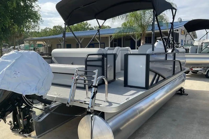 Slide: The Image of 2026 Crest Conquest SE 220 Cruise pontoon boat with canopy and outboard motor. - 11