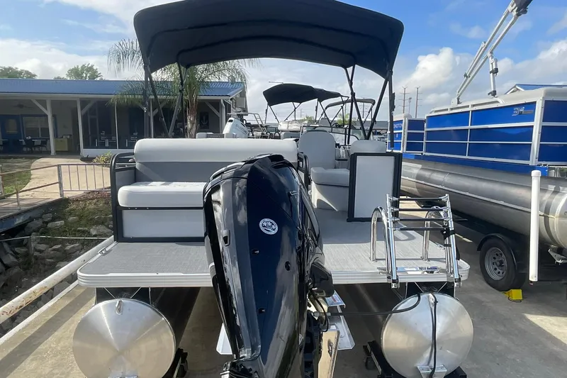 Slide: The Image of 2026 Crest Conquest SE 220 Cruise pontoon boat with outboard motor and canopy. - 7