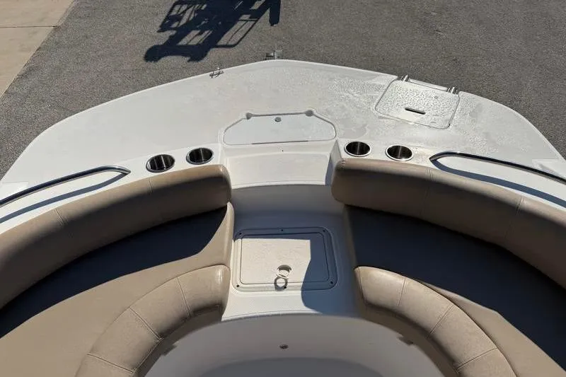 Slide: The Image of 2022 Hurricane SunDeck Sport 201 OB boat interior with seating and cup holders. - 11