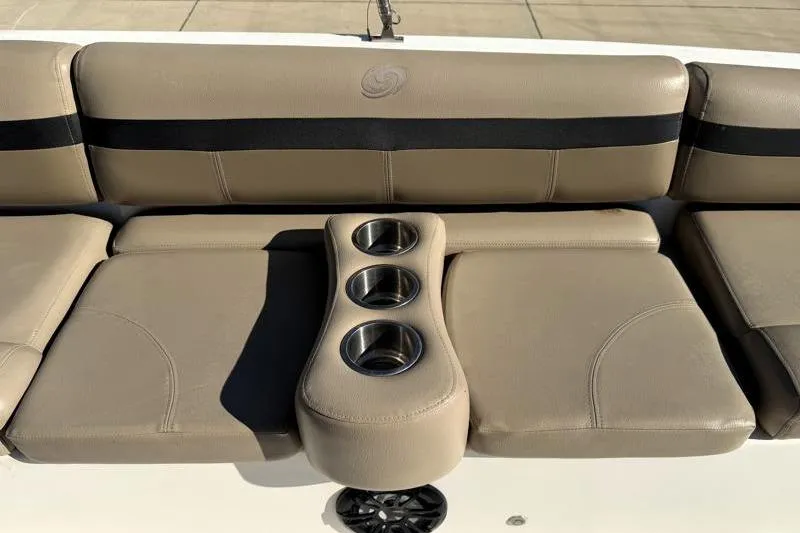 Slide: The Image of 2022 Hurricane SunDeck Sport 201 OB boat seating with cup holders, beige upholstery. - 15