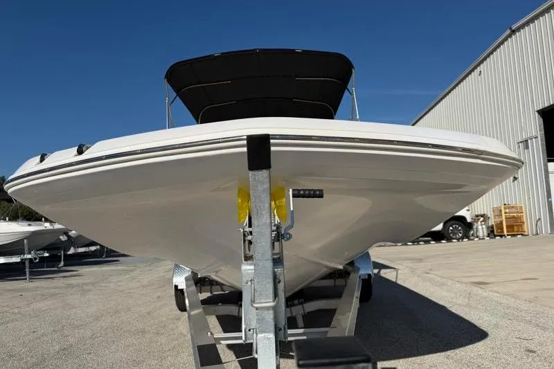 Slide: The Image of 2022 Hurricane SunDeck Sport 201 OB boat on trailer, front view, sunny day. - 6