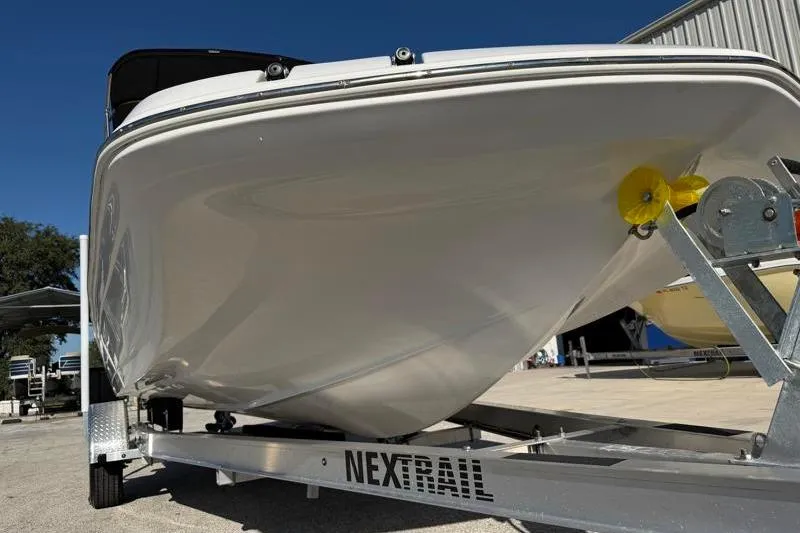 Slide: The Image of 2022 Hurricane SunDeck Sport 201 OB boat on Nextrail trailer, viewed from the front. - 7