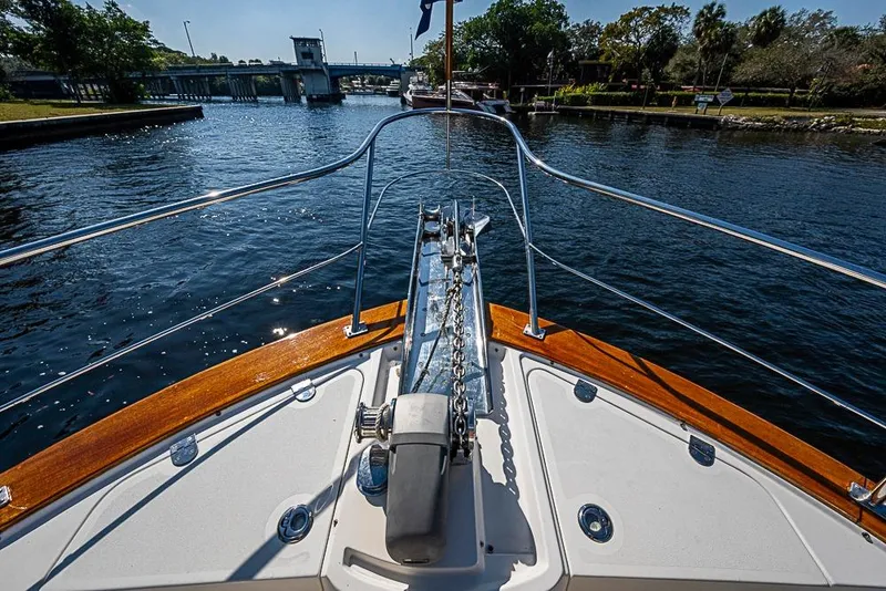 Slide: The Image of Bow view of 2013 Grand Banks 43 Europa yacht on a calm waterway. - 13