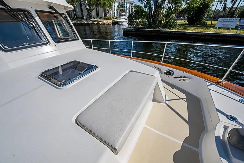 Slide: The Image of 2013 Grand Banks 43 Europa yacht deck with seating and water view. - 15