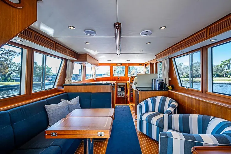 Slide: The Image of Interior of 2013 Grand Banks 43 Europa yacht with elegant wood finish and comfortable seating. - 3