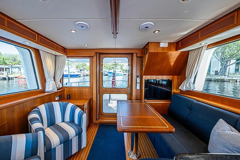 Slide: The Image of Luxurious interior of 2013 Grand Banks 43 Europa yacht with elegant wood finish and seating. - 30