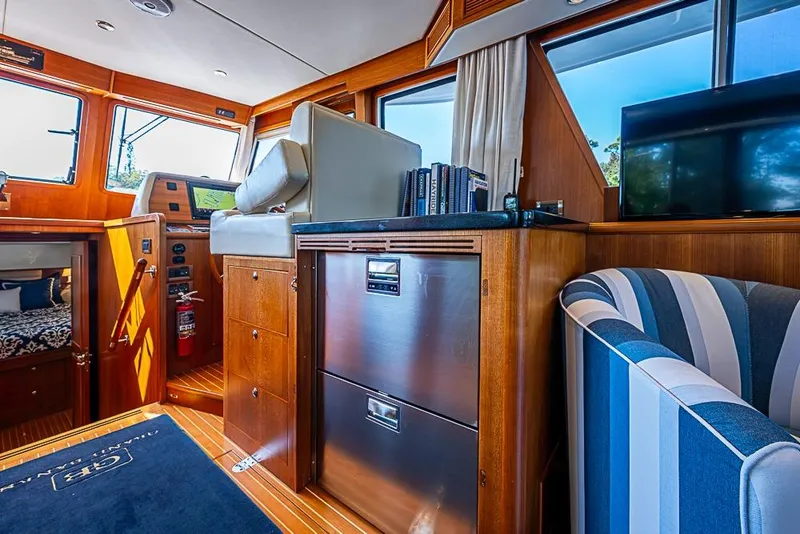 Slide: The Image of Interior of 2013 Grand Banks 43 Europa yacht with modern furnishings and navigation equipment. - 34