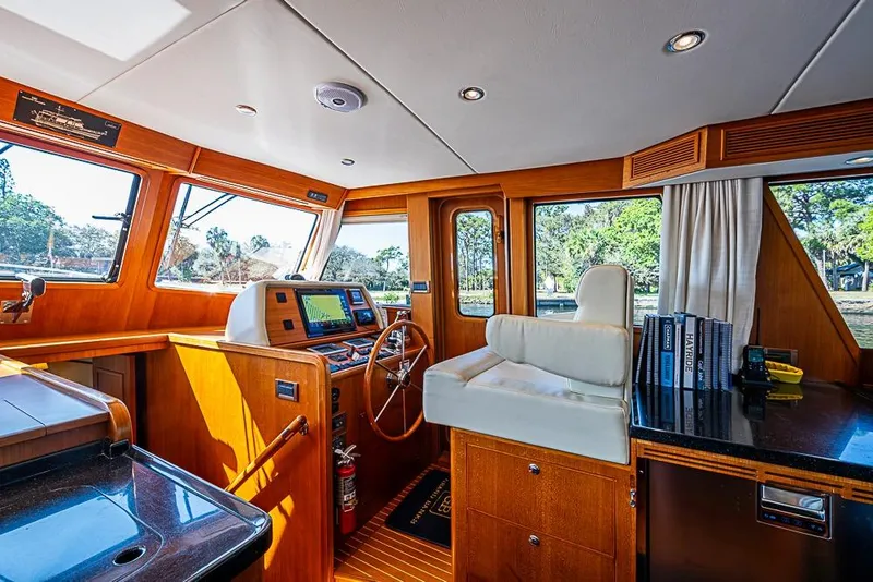 Slide: The Image of Interior of 2013 Grand Banks 43 Europa yacht with wooden helm and navigation equipment. - 39