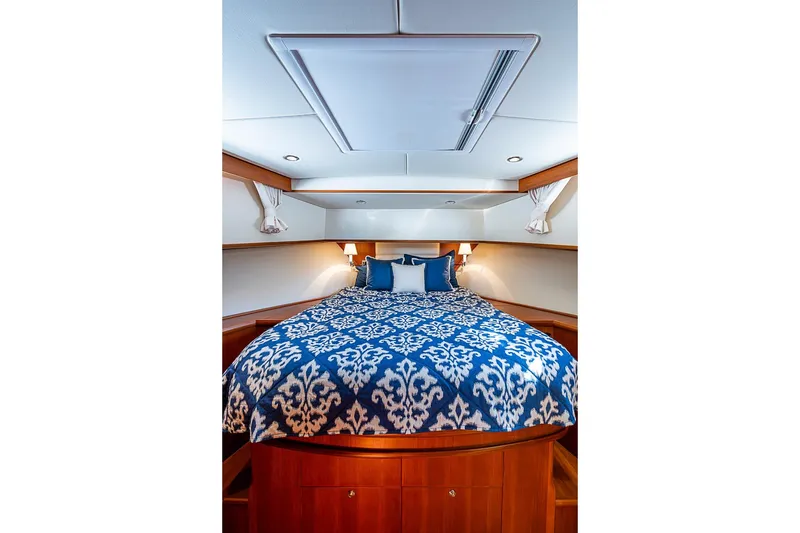 Slide: The Image of Luxurious cabin interior of 2013 Grand Banks 43 Europa yacht with elegant bedding. - 44