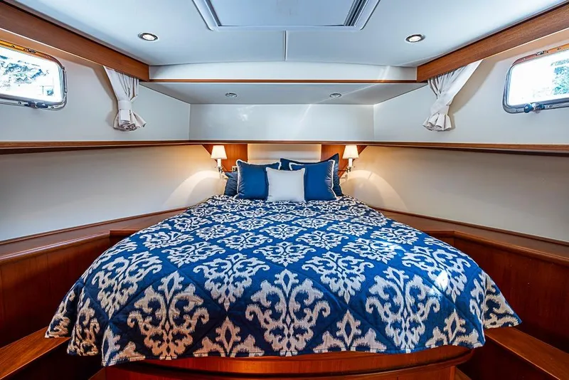 Slide: The Image of Luxurious cabin interior of 2013 Grand Banks 43 Europa yacht with elegant bedding. - 46