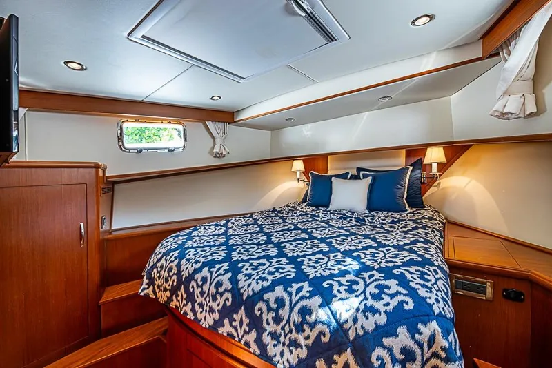 Slide: The Image of Luxurious cabin interior of 2013 Grand Banks 43 Europa yacht with elegant bedding. - 47