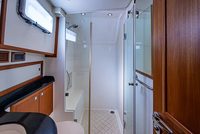 Slide: The Image of Luxurious bathroom interior of 2013 Grand Banks 43 Europa yacht with glass shower. - 49