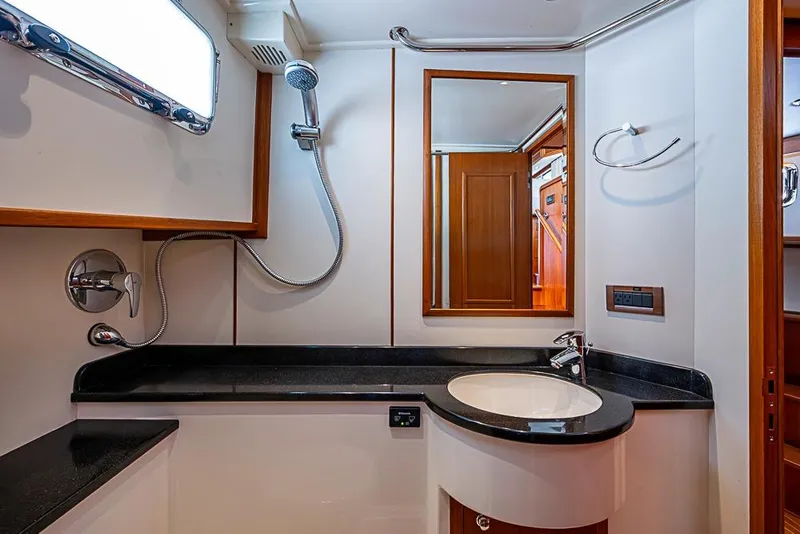 Slide: The Image of Luxurious bathroom interior of 2013 Grand Banks 43 Europa yacht, featuring modern fixtures. - 58