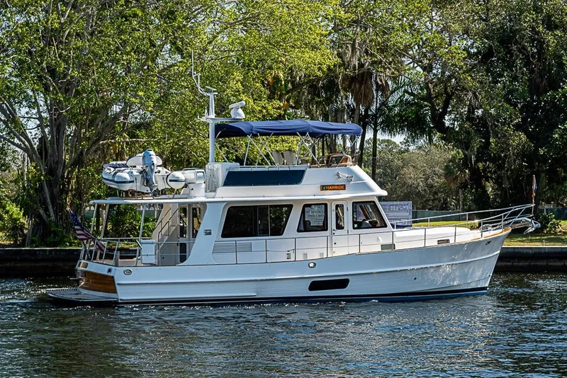 Slide: The Image of 2013 Grand Banks 43 Europa yacht cruising on a scenic waterway. - 6