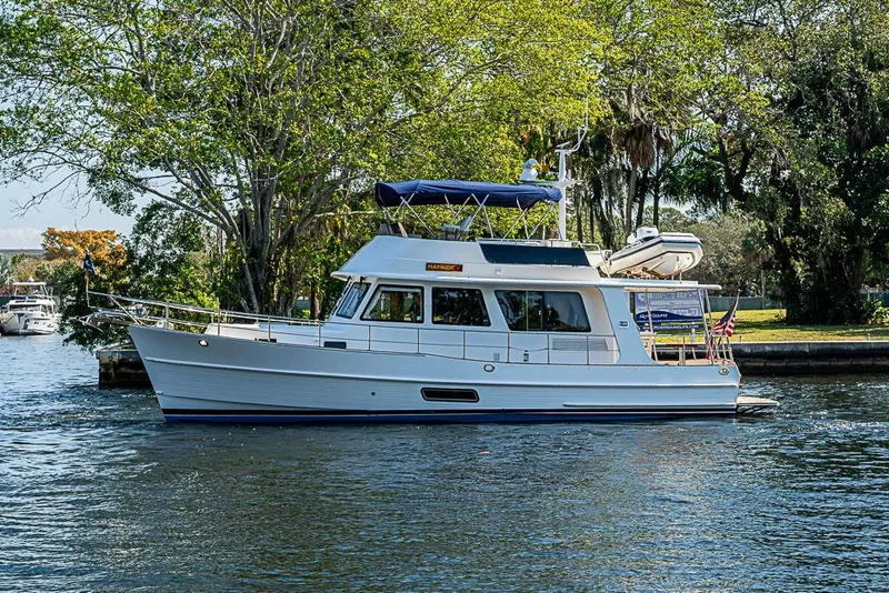 Slide: The Image of 2013 Grand Banks 43 Europa yacht cruising on a scenic waterway. - 66