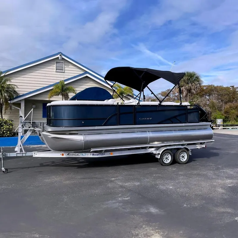 The Image of 2026 Crest Conquest SE 220 Fish pontoon boat on trailer. - 0