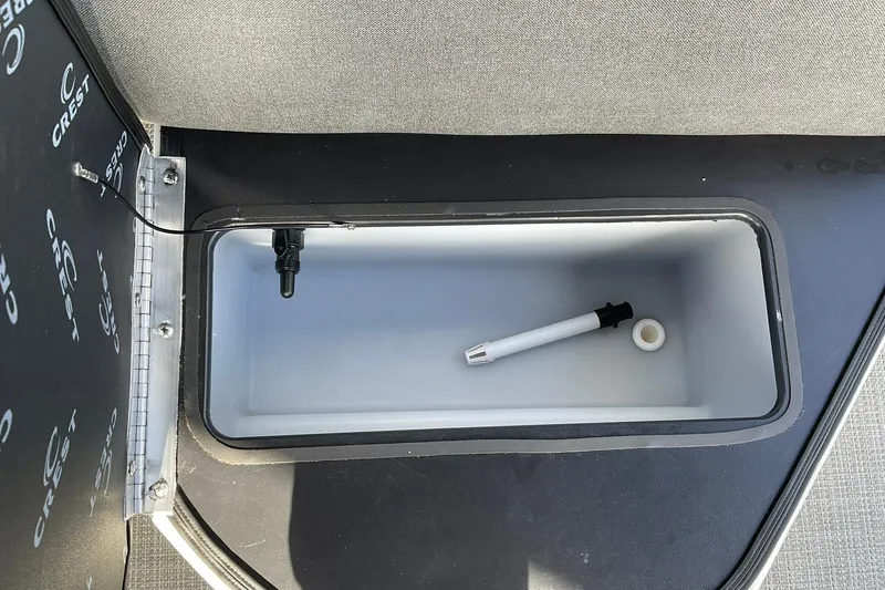Slide: The Image of Storage compartment in 2026 Crest Conquest SE 220 Fish boat interior. - 10