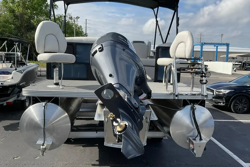Slide: The Image of 2026 Crest Conquest SE 220 Fish pontoon boat with dual seats and powerful outboard motor. - 11