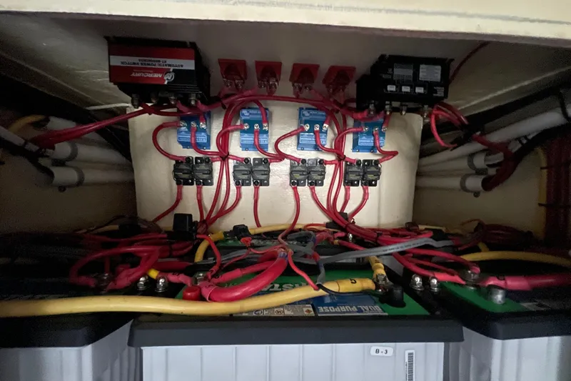 Slide: The Image of Electrical wiring and battery setup in a 2016 Bahama 41 boat. - 12
