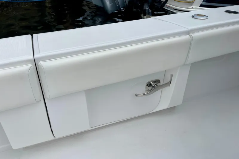 Slide: The Image of White seating and storage compartment on a 2016 Bahama 41 boat. - 18