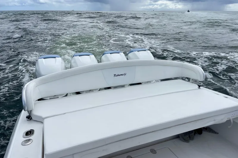 Slide: The Image of 2016 Bahama 41 boat with four engines cruising on open water. - 8