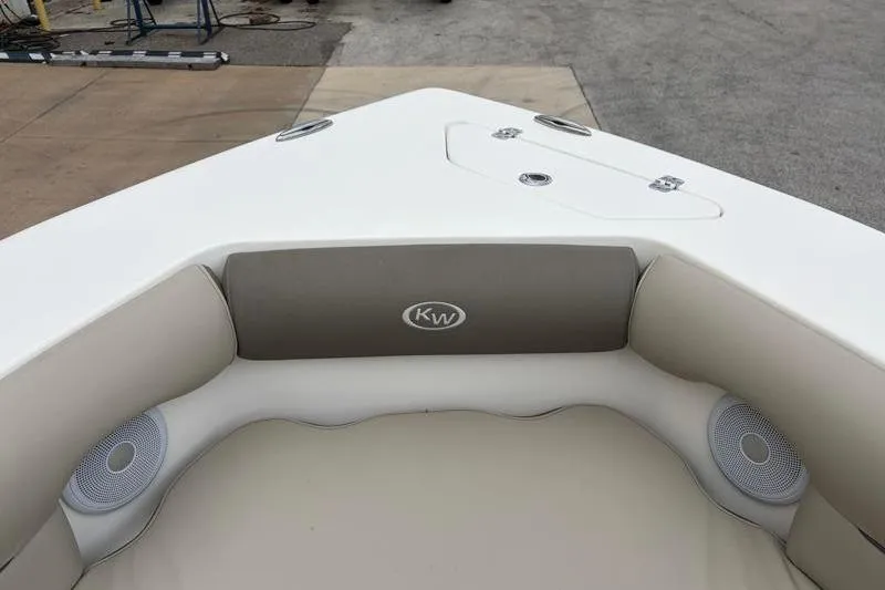Slide: The Image of 2024 Key West 239 DFS boat interior with cushioned seating and speakers. - 17
