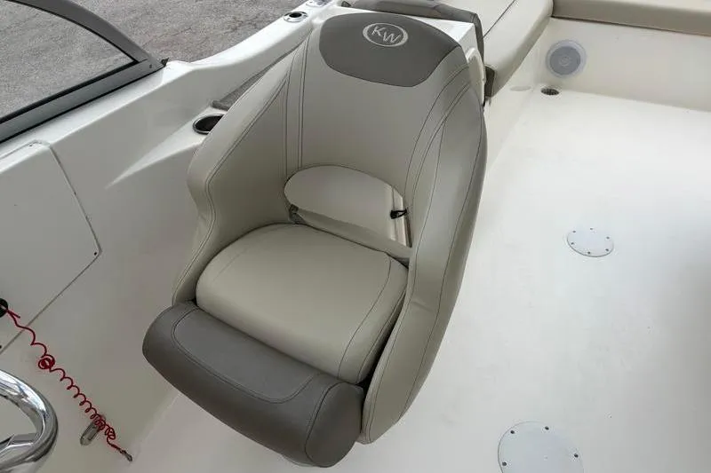 Slide: The Image of 2024 Key West 239 DFS boat seat, featuring gray and white upholstery with KW logo. - 22