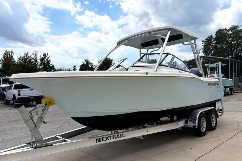 Slide: The Image of 2024 Key West 239 DFS boat on trailer under cloudy sky. - 3