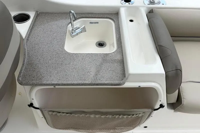 Slide: The Image of 2024 Key West 239 DFS boat sink with countertop and storage compartment. - 31