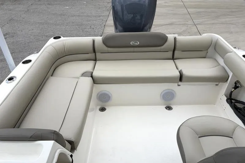 Slide: The Image of 2024 Key West 239 DFS boat interior with beige seating and cup holders. - 33