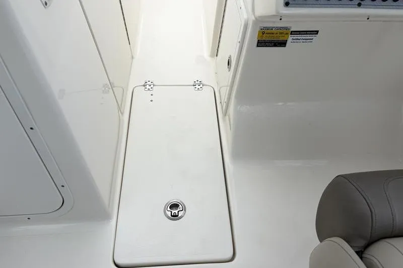 Slide: The Image of 2024 Key West 239 DFS boat interior with storage compartment and seating. - 36