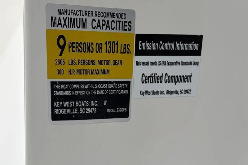 Slide: The Image of 2024 Key West 239 DFS capacity label: 9 persons or 1301 lbs, 300 HP max. - 37