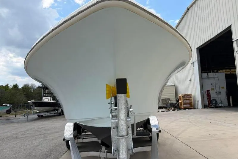 Slide: The Image of 2024 Key West 239 DFS boat on trailer outside a large warehouse. - 8