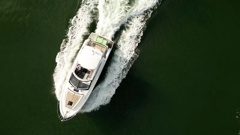 Slide: The Image of Aerial view of 2018 Jeanneau Leader 40 yacht cruising on open water. - 2