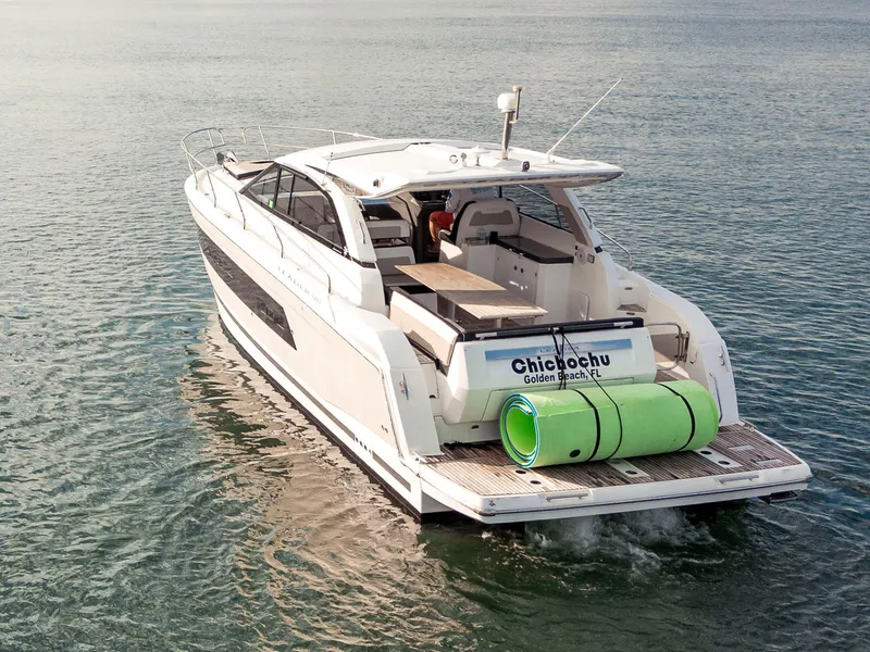 Slide: The Image of 2017 Jeanneau Leader 40 yacht cruising on calm waters, rear view. - 28