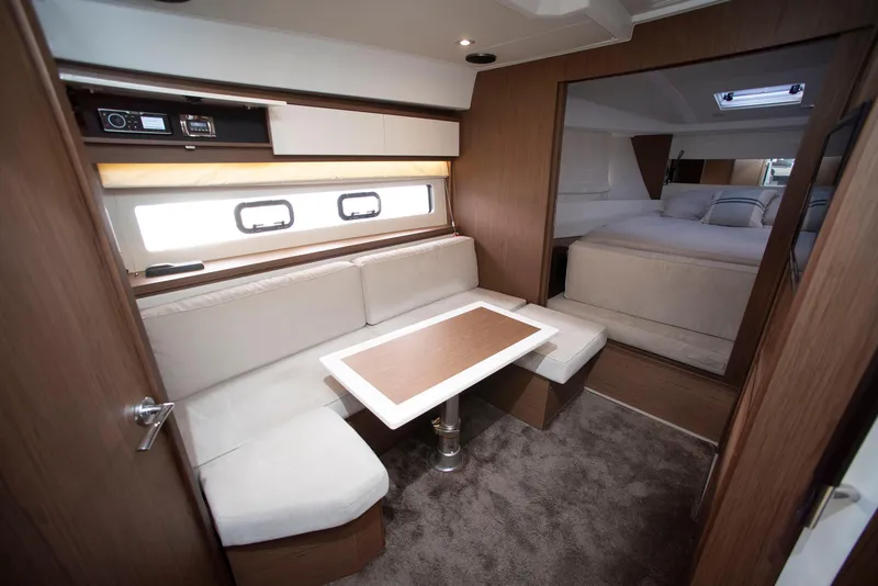 Slide: The Image of 2017 Jeanneau Leader 40 interior with cozy seating and elegant wood finishes. - 35