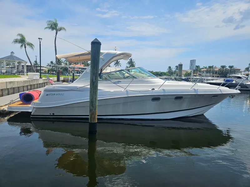 The Image of 2005 Four Winns 378 Vista yacht docked in a sunny marina. - 0