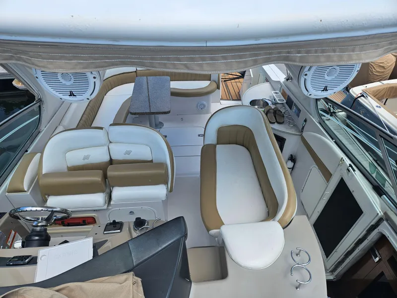 Slide: The Image of 2005 Four Winns 378 Vista boat interior with beige and white seating. - 10