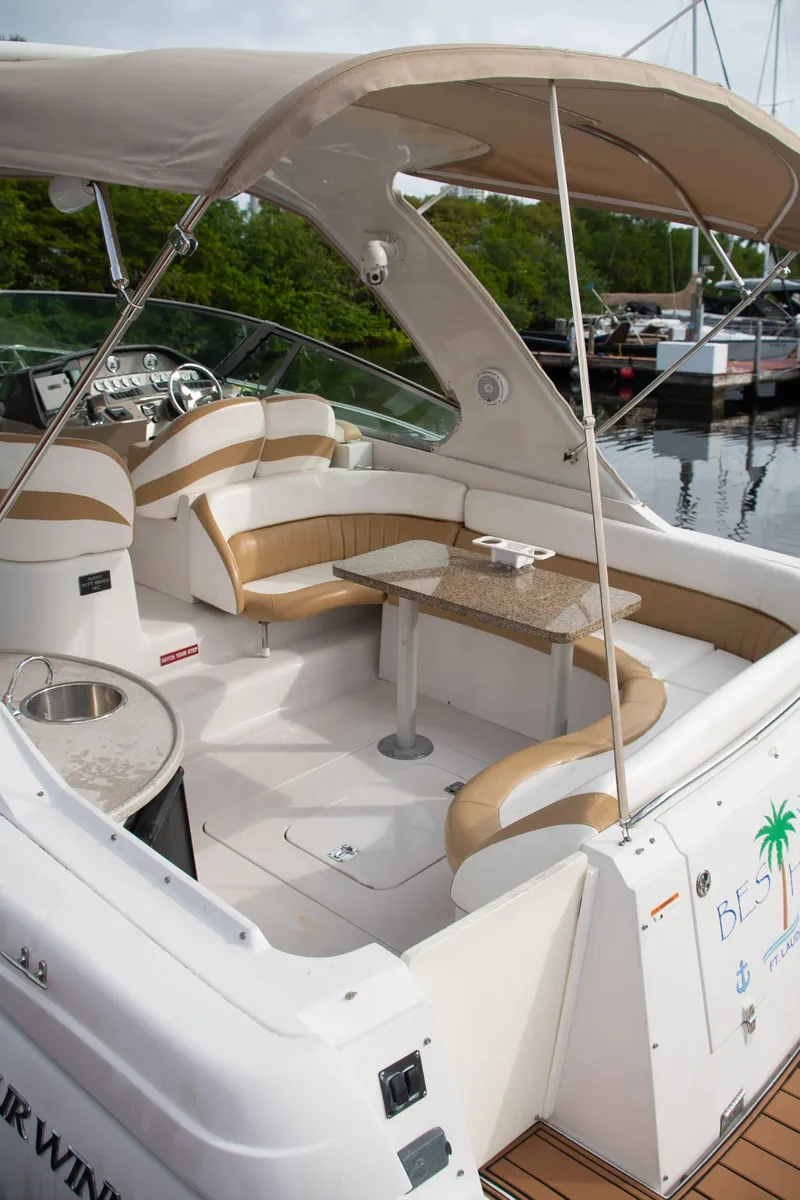 Slide: The Image of 2005 Four Winns 378 Vista yacht with spacious seating and elegant design at a marina. - 13
