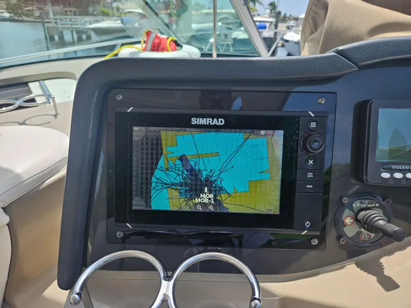 Slide: The Image of Simrad navigation system on 2005 Four Winns 378 Vista boat dashboard. - 24