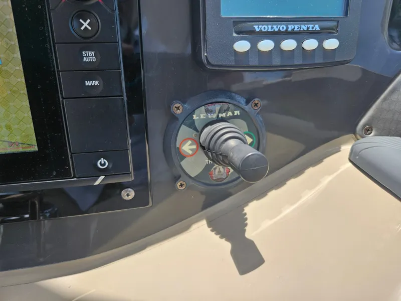 Slide: The Image of Control panel of a 2005 Four Winns 378 Vista boat with Lewmar joystick. - 25