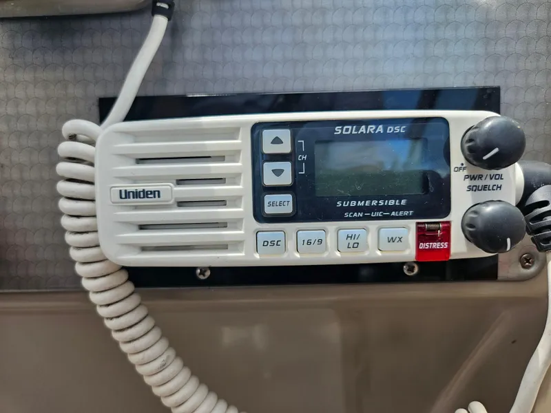 Slide: The Image of Uniden Solara DSC marine radio on 2005 Four Winns 378 Vista boat dashboard. - 26