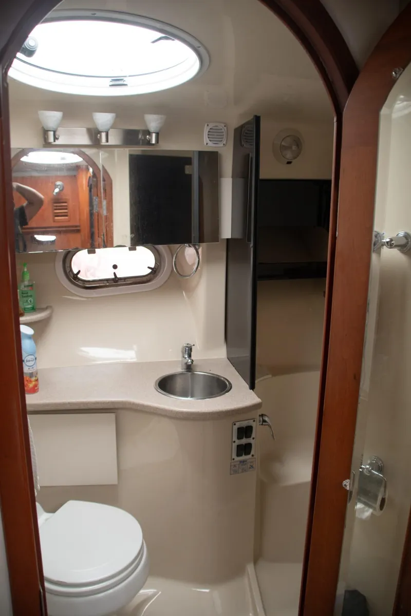Slide: The Image of 2005 Four Winns 378 Vista yacht bathroom with sink, toilet, and mirror. - 34