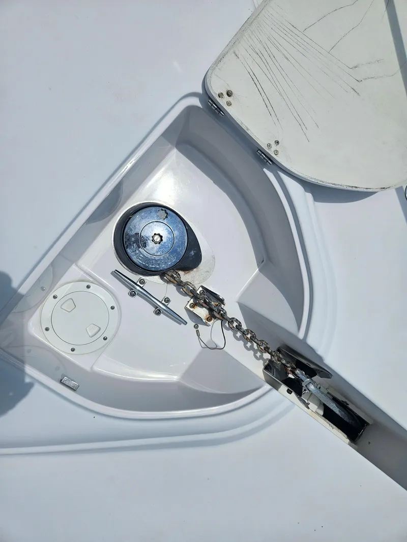 Slide: The Image of Anchor compartment of 2005 Four Winns 378 Vista boat, featuring chain and winch. - 5