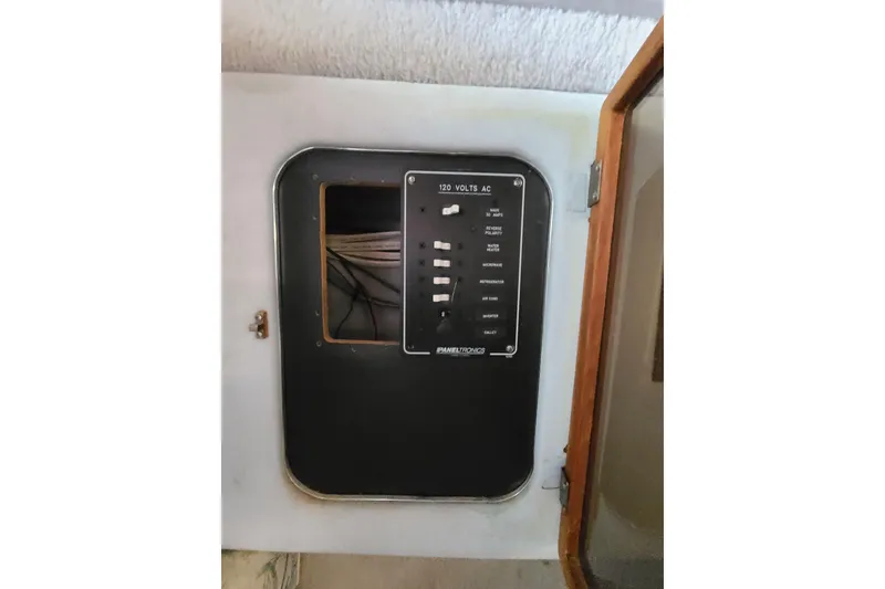 Slide: The Image of Electrical panel inside 1987 Sea Ray 300 Sundancer boat, showing circuit breakers. - 20